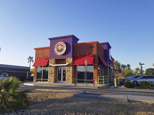 This March 4, 2020 photo shows a Panda Express restaurant in Phoenix. Getting a trademark for the new name can lead to ugly and sometimes public clashes over ownership and cultural appropriation. In recent years, businesses have butted heads over whether a restaurant or food truck can legally own the right to use words rooted in Asian American Pacific Islander cultures like &#147;aloha&quot; and &#147;poke.&#148; (AP Photo/Terry Tang)