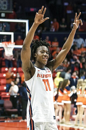 FILE - In this March 8, 2020, file photo, Illinois' Ayo Dosunmu (11) celebrates a 78-76 win over Iowa in the second half of an NCAA college basketball game in Champaign, Ill. Dosunmu was selected to the Associated Press All-Big Ten team selected Tuesday, March 10, 2020. (AP Photo/Holly Hart, File)