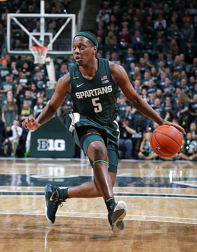 FILE - In this Feb. 4, 2020, file photo, Michigan State's Cassius Winston drives against Penn State during the second half of an NCAA college basketball game in East Lansing, Mich. Winston was selected to the Associated Press All-Big Ten team selected Tuesday, March 10, 2020. (AP Photo/Al Goldis, File)