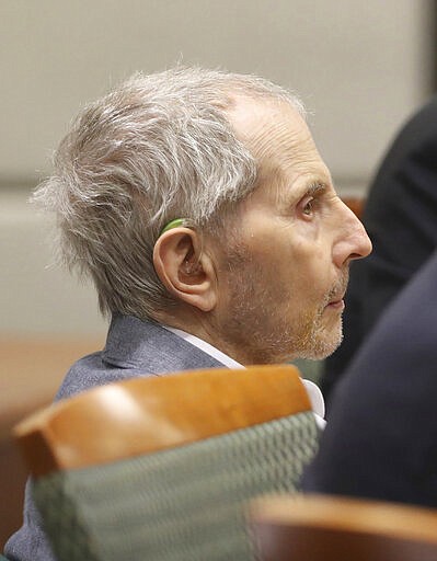 Robert Durst listens as opening statements in his murder trial continue Monday, March 9, 2020 in Los Angeles. (Lucy Nicholson/Pool Photo via AP)