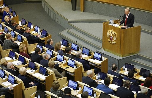 Russian President Vladimir Putin speaks during a session prior to voting for constitutional amendments at the State Duma, the Lower House of the Russian Parliament in Moscow, Russia, Tuesday, March 10, 2020. Putin says he supports a proposed constitutional amendment that would allow him to seek another term and remain in power. Putin gave his support Tuesday to the amendment put forward by a lawmaker who as a Soviet cosmonaut became the first woman to fly to space. (AP Photo/Pavel Golovkin)