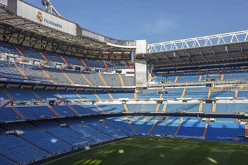 General view of the Santiago Bernabeu stadium in Madrid, Spain, Tuesday, March 10, 2020. All upcoming professional soccer games in Spain, France and Portugal, as well as some in Germany and a European Championship qualifying match in Slovakia, will be played in empty stadiums because of the coronavirus outbreak. For most people, the new coronavirus causes only mild or moderate symptoms, such as fever and cough. For some, especially older adults and people with existing health problems, it can cause more severe illness, including pneumonia. (AP Photo)