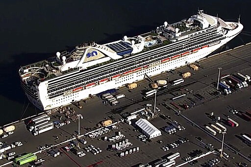 This photo taken from pool video provided by KGO-TV, shows the Grand Princess cruise ship at the Port of Oakland, Tuesday, March 10, 2020, in Oakland, Calif. Thousands of increasingly bored and restless passengers aboard a cruise ship struck by the coronavirus waited for their turn Tuesday to get off the vessel and go into two weeks of quarantine at military bases around the U.S.  (KGO-TV via AP, Pool)