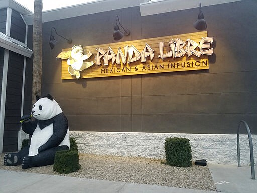 Panda Libre, an Asian-Mexican fusion restaurant, in Gilbert, Ariz., is pictured on Thursday, Feb. 27, 2020. When picking a name for their Asian-Mexican fusion restaurant in suburban Phoenix, Paul and Nicole Fan settled on &#147;Panda Libre,&#148; hoping the mix of China's iconic bear and the Spanish word for &#147;free&quot; would signal to customers the type of cuisine it offered. That decision could cost them dearly. Chinese takeout chain Panda Express sued them in federal court last month alleging trademark infringement.  (AP Photo/Terry Tang)