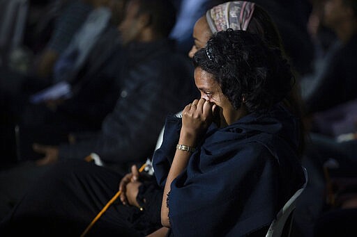 Colleagues and relatives mourn at a memorial service for the crew of Ethiopian Airlines Flight ET302, held at the Ethiopian Pilots Association in the capital Addis Ababa, in Ethiopia Tuesday, March 10, 2020. Relatives and colleagues gathered Tuesday to remember those who died one year ago when the jet crashed killing all 157 on board. (AP Photo/Mulugeta Ayene)