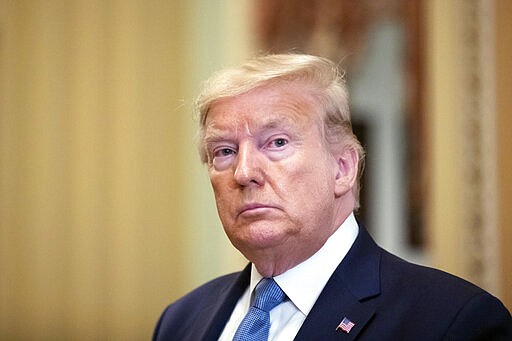 President Donald Trump departs after speaking with lawmakers on Capitol Hill, Tuesday, March 10, 2020, in Washington. (AP Photo/Alex Brandon)