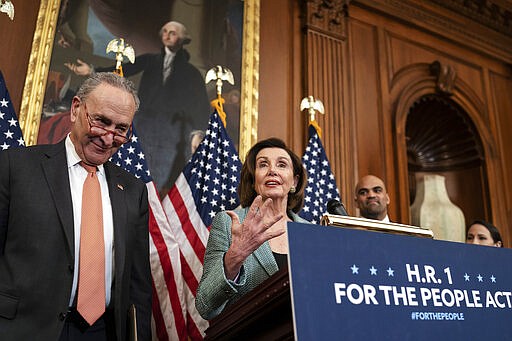 Senate Minority Leader Chuck Schumer, D-N.Y., left, and Speaker of the House Nancy Pelosi, D-Calif., call on Senate Majority Leader Mitch McConnell, R-Ky., to bring the Democrats' HR-1 &quot;For the People Act&quot; to the floor for a vote, during an event on Capitol Hill in Washington, Tuesday, March 10, 2020. (AP Photo/J. Scott Applewhite)