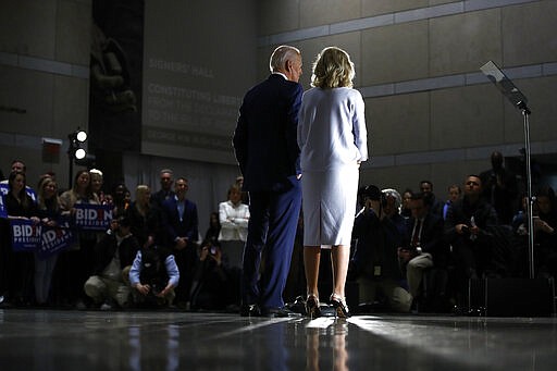 Democratic presidential candidate former Vice President Joe Biden, accompanied by his wife Jill, speaks to members of the press at the National Constitution Center in Philadelphia, Tuesday, March 10, 2020. (AP Photo/Matt Rourke)