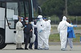 Coronavirus clusters swell on both sides of the US