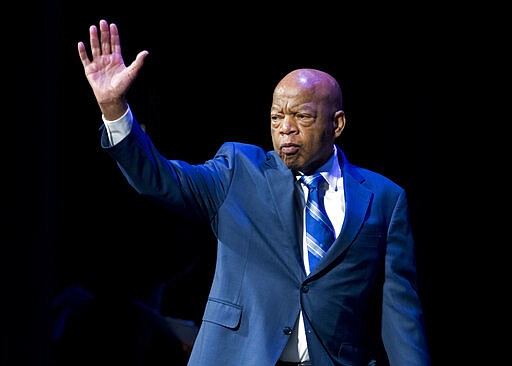 FILE- In this Jan. 3, 2019, file photo, Rep. John Lewis, D-Ga., waves to the audience during swearing-in ceremony of Congressional Black Caucus members of the 116th Congress in Washington. The NAACP is honoring Lewis for his Congressional service and long history as a civil rights activist. (AP Photo/Jose Luis Magana, File)