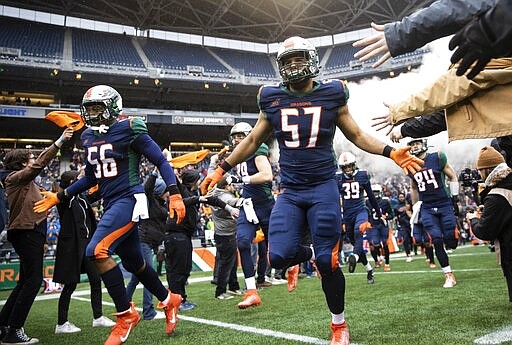 Seattle Dragons defensive end Marcel Frazier enters CenturyLink Field for the team's XFL home-opener against the Tampa Bay Vipers on Saturday, Feb. 15, 2020, in Seattle. (Amanda Snyder/The Seattle Times via AP)