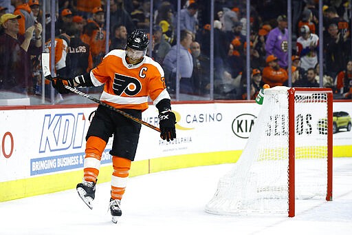 Philadelphia Flyers' Claude Giroux reacts after losing an NHL hockey game against the Boston Bruins, Tuesday, March 10, 2020, in Philadelphia. Boston won 2-0. (AP Photo/Matt Slocum)