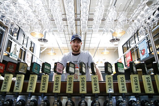 In this March 9, 2020, photo, Philadelphia Flyers' Kevin Hayes poses for a photograph at Yards Brewing Company, in Philadelphia. Hayes&#146; addition has been a big part of the Flyers success, his popularity soaring to the point there&#146;s now a Big Hayes-y IPA on tap at Yards Brewery. (AP Photo/Matt Slocum)