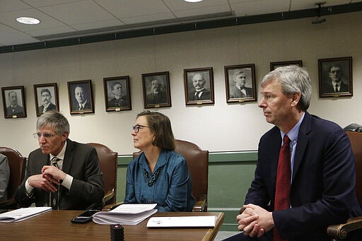 From left to right, Reps. Timm Ormsby, June Robinson and House Majority Leader Pat Sullivan meet with the media to discuss a supplemental budget plan that includes money for COVID-19 response, Wednesday, March 11, 2020 in Olympia, Wash. Lawmakers are racing to finish their work before the 60-day legislative session ends Thursday amid growing concerns over the coronavirus outbreak. Lawmakers are racing to finish their work before the 60-day legislative session ends Thursday amid growing concerns over the coronavirus outbreak. For most people, the new coronavirus causes only mild or moderate symptoms. For some it can cause more severe illness. (AP Photo/Rachel La Corte)