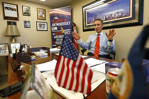 In this Thursday, March 5, 2020 photo, Virginia State Sen. Joe Morrissey, D-Richmond, gestures during an interview in his office at the Capitol in Richmond, Va. The former prosecutor-turned-defense attorney, who calls himself &quot;Fighting Joe&quot; has pushed his way back into the political fold. (AP Photo/Steve Helber)