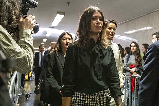 Dawn Dunning, center arrives at court for Harvey Weinstein's sentencing, in New York, Wednesday, March 11, 2020. She is followed by Miriam Haley, background left, and Tarale Wulff, background right. (AP Photo/Richard Drew)