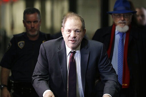 FILE - In this Feb. 20, 2020 file photo, Harvey Weinstein arrives at a Manhattan courthouse for his rape trial in New York.  Weinstein was sentenced Wednesday, March 11,  to 23 years in prison for rape and sexual assault.  (AP Photo/Seth Wenig, File)