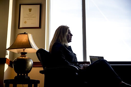 Wendy Woolcok, the special agent in charge of the Drug Enforcement Administration's special operations division, speaks during an interview at their command center in Chantilly, Va., Wednesday, March 11, 2020, as &quot;Project Python&quot; coordinates arrests simultaneously across the country.  (AP Photo/Andrew Harnik)