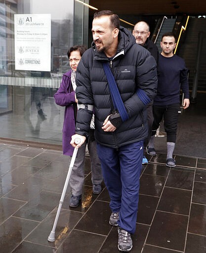 FILE - In this June 14, 2019, file photo, Temel Atacocugu, a victim from the March 15, 2019 Christchurch mosque shootings, leaves the Christchurch District Court in Christchurch, New Zealand. When the gunman walked into the  Al Noor mosque, Atacocugu was kneeling for Friday prayers. He looked up into the man's face, thinking he was a police officer because of his paramilitary outfit. Time slowed. Temel saw a puff of smoke come from the raised gun, felt a bullet smash into his teeth, and thought: &quot;Oh, my God, I'm dying.&quot; (AP Photo/Mark Baker, File)