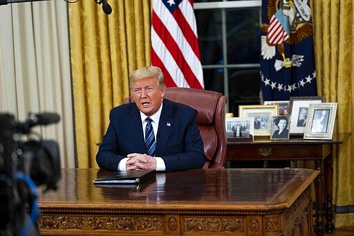 President Donald Trump speaks in an address to the nation from the Oval Office at the White House about the coronavirus Wednesday, March, 11, 2020, in Washington. (Doug Mills/The New York Times via AP, Pool)