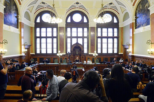 The media prepares for the preliminary hearing of the captain of the Viking Sigyn river cruiser in the Hableany case in Pest Central District Court in Budapest, Hungary, Wednesday, March 11, 2020. The Hableany sightseeing boat carrying 33 South Korean tourists and two Hungarian staff was sunk by the Viking Sigyn cruise ship on the Danube in central Budapest on May 29, 2019. Seven South Koreans survived, the others died. The Ukrainian boat captain has been charged with fatal negligence and failing to provide assistance to persons in danger in connection with the collision. The prosecution proposed a nine-year prison sentence and a nine-year ban on piloting boats on condition that the accused admitted guilt and waived his right to a trial. The accused rejected the deal and refused to testify. (Tamas Kovacs/MTI via AP)