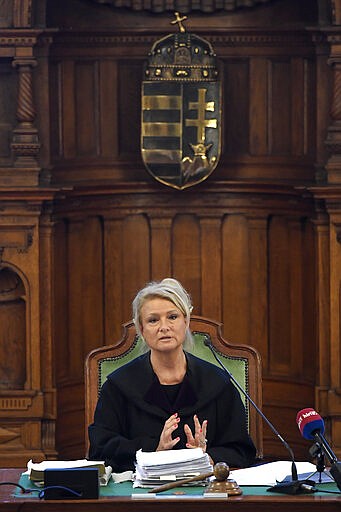 Judge Judit Leona Nemeth leads the preliminary hearing of the captain of the Viking Sigyn river cruiser in the Hableany case in Pest Central District Court in Budapest, Hungary, Wednesday, March 11, 2020. The Hableany sightseeing boat carrying 33 South Korean tourists and two Hungarian staff was sunk by the Viking Sigyn cruise ship on the Danube in central Budapest on May 29, 2019. Seven South Koreans survived, the others died. The Ukrainian boat captain has been charged with fatal negligence and failing to provide assistance to persons in danger in connection with the collision. The prosecution proposed a nine-year prison sentence and a nine-year ban on piloting boats on condition that the accused admitted guilt and waived his right to a trial. The accused rejected the deal and refused to testify. (Tamas Kovacs/MTI via AP)