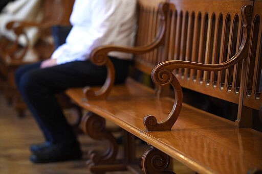 The captain of the Viking Sigyn river cruiser attends the preliminary hearing in the Hableany case in Pest Central District Court in Budapest, Hungary, Wednesday, March 11, 2020. The Hableany sightseeing boat carrying 33 South Korean tourists and two Hungarian staff was sunk by the Viking Sigyn cruise ship on the Danube in central Budapest on May 29, 2019. Seven South Koreans survived, the others died. The Ukrainian boat captain has been charged with fatal negligence and failing to provide assistance to persons in danger in connection with the collision. The prosecution proposed a nine-year prison sentence and a nine-year ban on piloting boats on condition that the accused admitted guilt and waived his right to a trial. The accused rejected the deal and refused to testify. (Tamas Kovacs/MTI via AP)