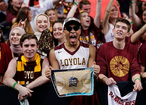 FILE - In this March 31, 2018, file photo, Loyola-Chicago fans cheer at the Final Four of the NCAA college basketball tournament in San Antonio. NCAA President Mark Emmert says NCAA Division I basketball tournament games will be played without fans in the arenas because of concerns about the spread of coronavirus. (AP Photo/Eric Gay, File)