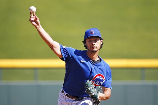 Chicago Cubs' Yu Darvish pitches in a simulated game at spring training in Sloan Park, Friday, March 6, 2020, in Mesa, Ariz. Amid widespread concern about the coronavirus, Chicago Cubs pitcher Yu Darvish decided to be extra careful after he developed a cough this week. (AP Photo/Sue Ogrocki)