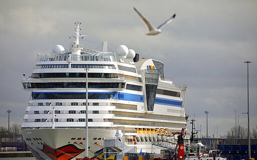 The cruise ship Aidamar is docked at the Port of Zeebrugge, Belgium, Wednesday, March 11, 2020. The ship was briefly held by port authorities on Wednesday over concerns regarding the coronavirus. For most people, the new coronavirus causes only mild or moderate symptoms, such as fever and cough. For some, especially older adults and people with existing health problems, it can cause more severe illness, including pneumonia. (AP Photo/Olivier Matthys)