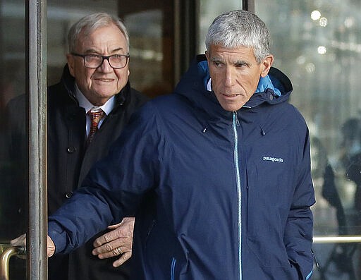 FILE &#151; In this Tuesday, March 12, 2019, file photo, William &quot;Rick&quot; Singer, right, founder of the Edge College &amp; Career Network, exits federal court in Boston, after he pleaded guilty to charges in a nationwide college admissions bribery scandal. Five coaches, including Singer, have pleaded guilty in the scandal. (AP Photo/Steven Senne, File)