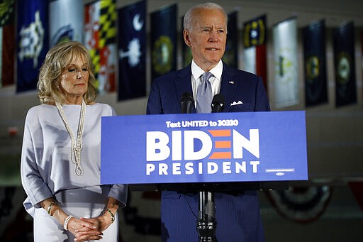 Democratic presidential candidate former Vice President Joe Biden, accompanied by his wife Jill, speaks to members of the press at the National Constitution Center in Philadelphia, Tuesday, March 10, 2020. (AP Photo/Matt Rourke)