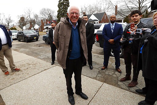 Democratic presidential candidate Sen. Bernie Sanders, I-Vt., visits outside a polling location at Warren E. Bow Elementary School in Detroit, Tuesday, March 10, 2020. (AP Photo/Paul Sancya)