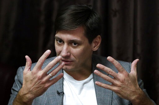 Russian opposition candidate Dmitry Gudkov gestures during his interview with the Associated Press in Moscow, Russia, Wednesday, March 11, 2020. Gudkov, a former lawmaker turned opposition politician, believes an early parliamentary election is likely, since he says the Kremlin would want the vote to be this year instead of next. &quot;They're in a rush and want to (pass the proposed constitutional amendments) with the sitting parliament, which they fully control,&quot; Gudkov. (AP Photo/Pavel Golovkin)