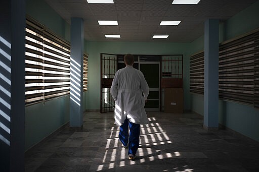 Dr. Vitaly Dedovich, of the Novick Cardiac Alliance medical team walks to the operating room at the Tajoura National Heart Center in Tripoli, Libya, on Feb. 24, 2020. Novick&#146;s group not only drops in a few times a year, but also trains Libyan doctors and nurses to build up the country&#146;s critical health care system. (AP Photo/Felipe Dana)