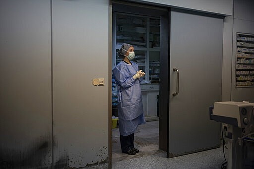 Nurse Martina Pavanic, of the Novick Cardiac Alliance medical team, stands in the operating room before a surgery at the Tajoura National Heart Center in Tripoli, Libya, on Feb. 24, 2020. (AP Photo/Felipe Dana)