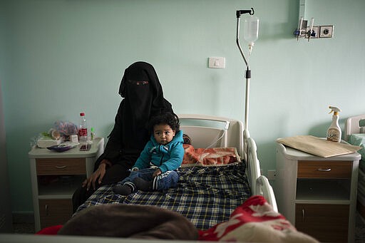 Yazan, 1, sits with his mother before his heart surgery at the Tajoura National Heart Center in Tripoli, Libya, on Feb. 27, 2020. Yazan&#146;s odyssey from his small desert hometown barely skirted the war&#146;s front lines. With key highways blocked because of fighting, his family took a 1,500-kilometer (932-mile) detour. (AP Photo/Felipe Dana)