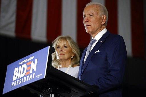 Democratic presidential candidate former Vice President Joe Biden, accompanied by his wife Jill, speaks to members of the press at the National Constitution Center in Philadelphia, Tuesday, March 10, 2020. (AP Photo/Matt Rourke)