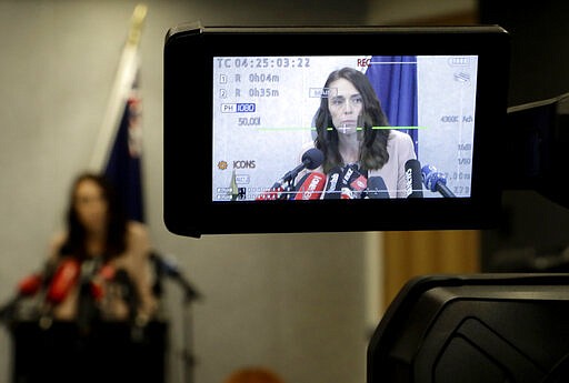 New Zealand Prime Minister Jacinda Ardern is seen on a TV camera's LCD screen as she addresses a press conference in Christchurch, New Zealand, Friday, March 13, 2020.Events to mark the death of fifty-one people who were killed and dozens more injured when a gunman attacked two mosques in Christchurch March 15, 2019 begin today. (AP Photo/Mark Baker)