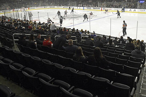 Empty seats are seen at the start of an NHL hockey game between the Los Angeles Kings and the Ottawa Senators on Wednesday, March 11, 2020, in Los Angeles. (AP Photo/Mark J. Terrill)