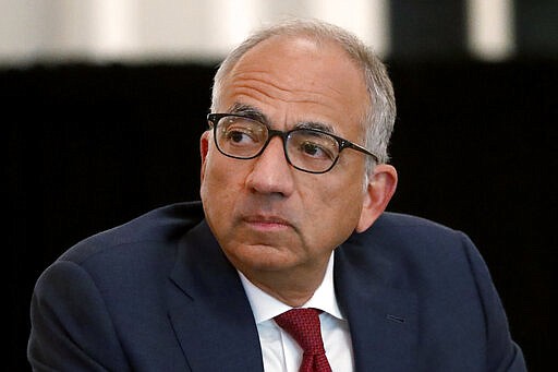 FILE - In this Dec. 6, 2019, file photo, U.S. Soccer President Carlos Cordeiro presides over a meeting of the U.S. Soccer Board of Directors in Chicago. Cordeiro resigned Thursday night, March 12, 2020, three days after the organization filed legal papers in a gender discrimination claiming women players had less physical ability and responsibility than men. (AP Photo/Charles Rex Arbogast, File)