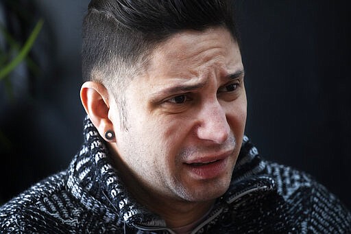 In this Feb. 28, 2020 photo, Venezuelan Kamal Morales discusses the plight of his Venezuelan boyfriend Gustavo Acosta during an interview in New York. Morales' boyfriend has spent the past year moving around U.S. immigrant detention centers in the deep south after they crossed the Mexico-U.S. border together to apply for asylum. Morales&#146; own asylum request was rejected and he was ordered deported, but is currently living in New York while on parole.&#160;(AP Photo/Mark Lennihan)