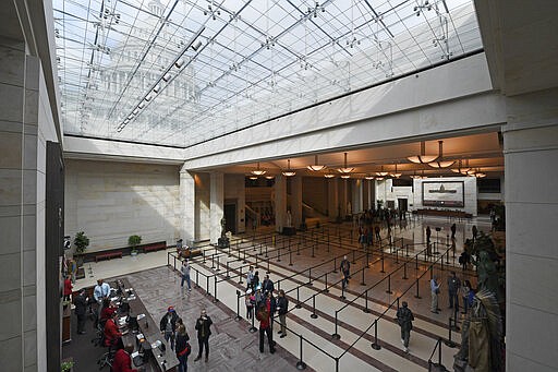 Tourists visit the Capitol Visitors Center on Capitol Hill in Washington, Thursday, March 12, 2020. Congress is shutting the Capitol to the public until April in reaction to the spread of the coronavirus, officials announced Thursday, a rare step that underscores the growing gravity with which the government is reacting to the viral outbreak. (AP Photo/Susan Walsh)