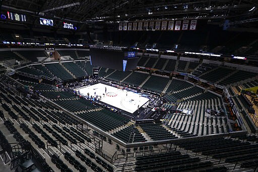 This photo shows the seating area at Bankers Life Fieldhouse, Thursday, March 12, 2020, in Indianapolis, after the Big Ten Conference announced that remainder of the men's NCAA college basketball games tournament was canceled. (AP Photo/Michael Conroy)