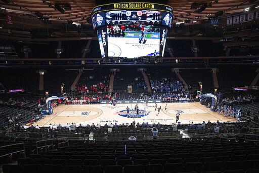 A few basketball fans watch as Creighton takes on St. John's in an NCAA college basketball game in the quarterfinals of the Big East Conference tournament, Thursday, March 12, 2020, at Madison Square Garden in New York. (AP Photo/Mary Altaffer)