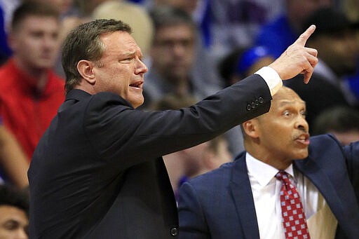 Kansas coach Bill Self makes a point during the first half of the team's NCAA college basketball game against TCU in Lawrence, Kan., Wednesday, March 4, 2020. Self won his 500th game at Kansas. Kansas won 75-66, and Self picked his 500th win at Kansas. (AP Photo/Orlin Wagner)