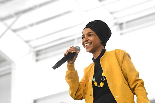 FILE - In this Feb. 29, 2020 file photo, Rep. Ilhan Omar, D-Minn., speaks at a rally in Springfield, Mass. Rep. Omar has announced her remarriage, just four months after her marriage ended following an allegation she was having an affair with her political consultant. Omar posted the news on her Instagram account Wednesday, March 11, 2020, with a photo that showed her and a bearded man smiling and displaying wedding rings. (AP Photo/Susan Walsh File)