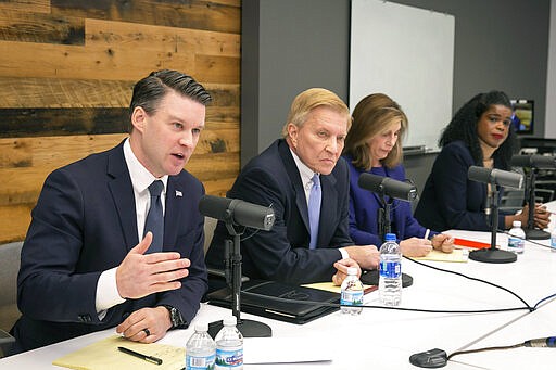 In this Tuesday, Feb. 4, 2020 photo, Cook County Democratic State's Attorney candidates, from left, Bill Conway, Bob Fioretti, Donna More and incumbent Kim Foxx meet with the Sun-Times Editorial Board in Chicago. The Chicago area's top prosecutor is trying to convince voters of her criminal justice reform record as she faces continued questions about her handling of actor Jussie Smollett's case. (Rich Hein/Chicago Sun-Times via AP)