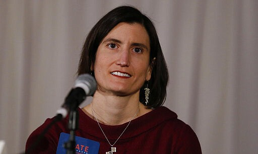 In this photo from Feb. 18, 2020, Kate Schroder, democratic candidate for Ohio's first congressional district, speaks during a question and answer session held by the Bold New Democracy Work Group, in Cincinnati. Some years, Democrats have struggled to field a viable candidate in Ohio's 1st U.S. House district. This year, they have two. Schroder, a career health-care advocate, and Nikki Foster, a veteran Air Force pilot, who have shown the ability to raise money and attract supporters as they prepare to clash in the state's March 17 primary for the nomination to challenge 12-term Republican incumbent Steve Chabot of Cincinnati. (AP Photo/Gary Landers)