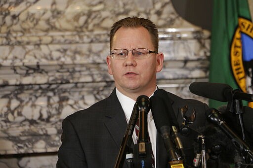 State Superintendent of Public Instruction Chris Reykdal talks to the media about the decision to close schools in three counties in response to COVID-19, Thursday, March 12, 2020, in Olympia, Wash. All public and private K-12 schools in King, Pierce and Snohomish counties will be closed for six weeks, and Gov. Jay Inslee said there could be closures in more counties soon. (AP Photo/Rachel La Corte)